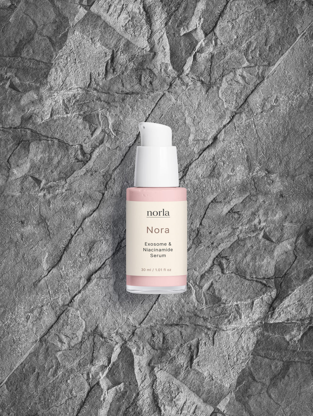Nora — Exosome & Niacinamide Serum by Norla on grey stone